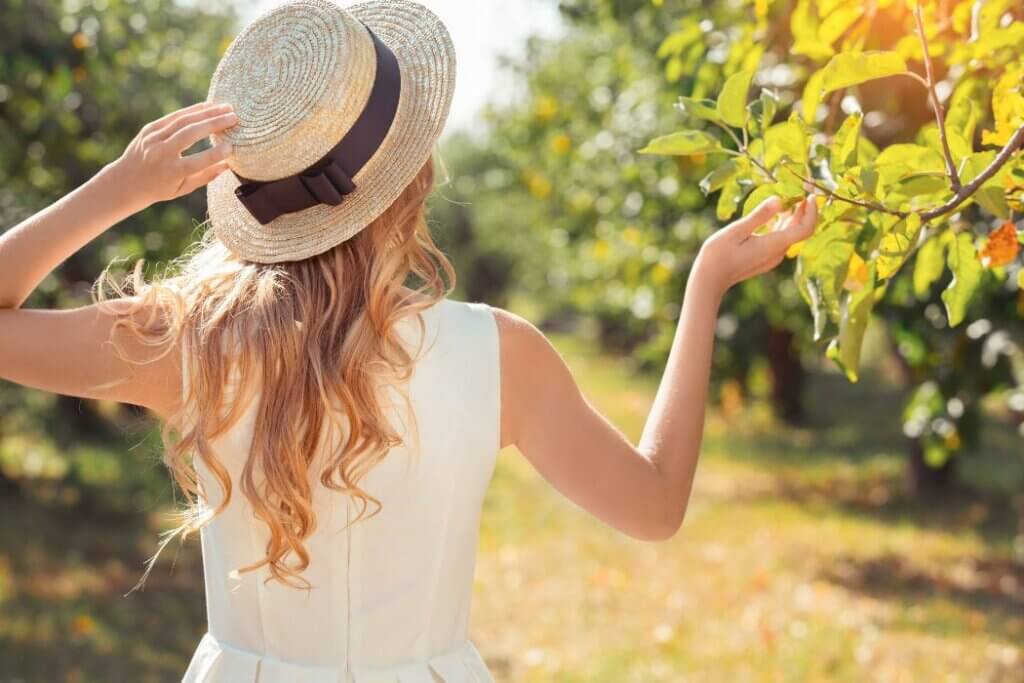 Blonde woman wearing straw hat