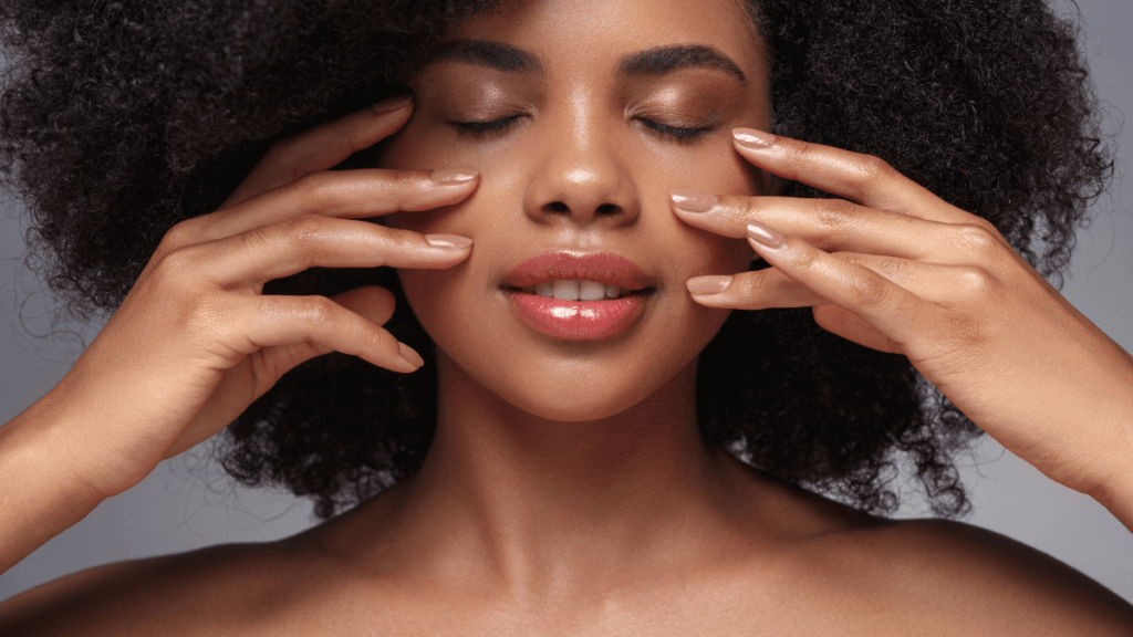 An image of a darker skin woman with a beautiful and healthy skin complexion for an article about the perfect skincare treatments for darker skin