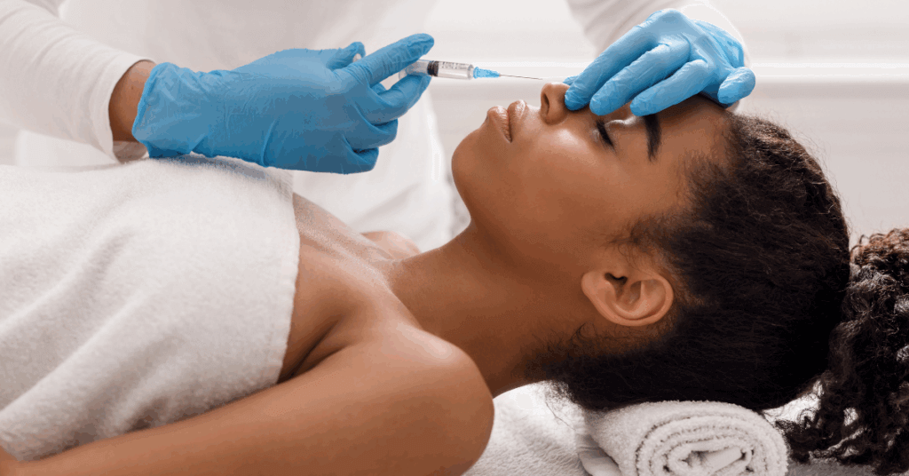 image of a woman getting dermal fillers to tweak the appearance of her nose without the need for surgery