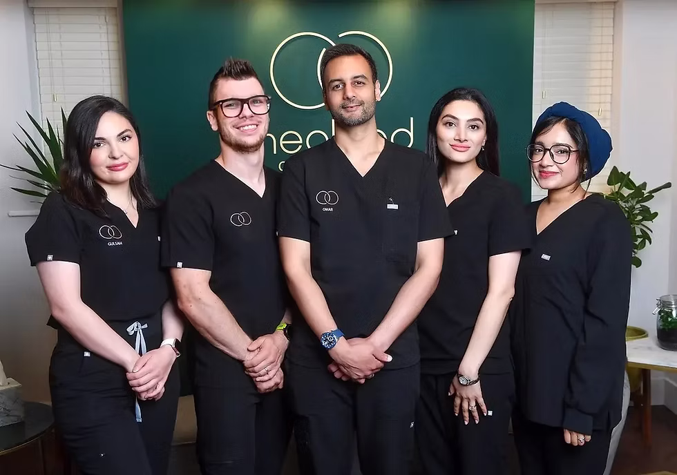 An image of Dr Omar Babar and his team at Healand Clinic