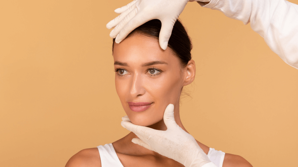 An image of a woman having her face examined for a facelift procedure