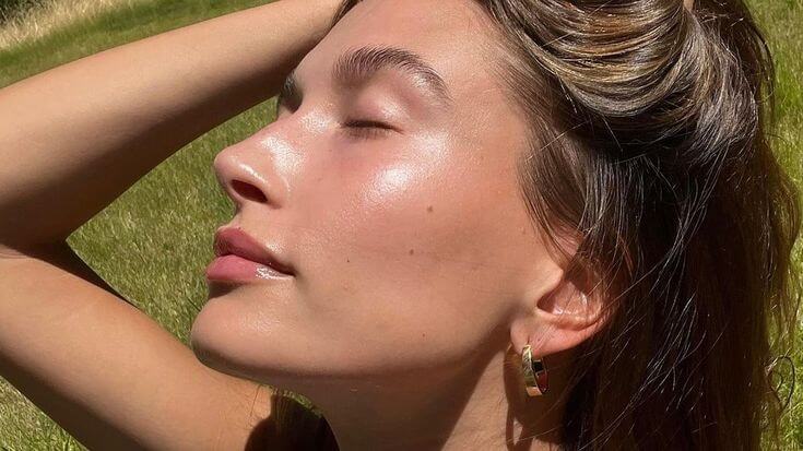Hailey Bieber's glazed donut skin is thought to be due to slugging, a monster beauty treatment