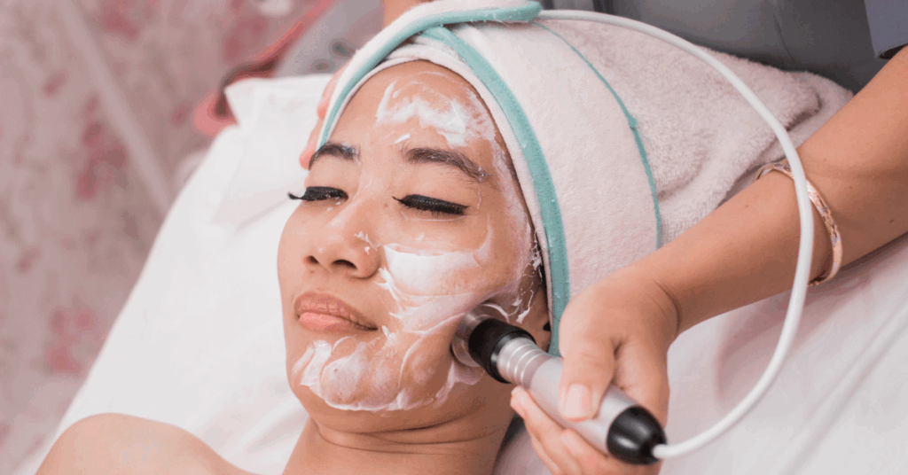 An image of a woman getting an aesthetic treatment to create a youthful jawline