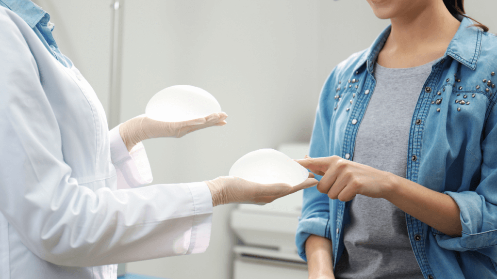 Woman choosing breast implants in clinic