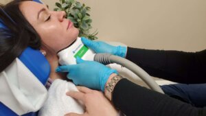 Woman getting a chin reduction treatment