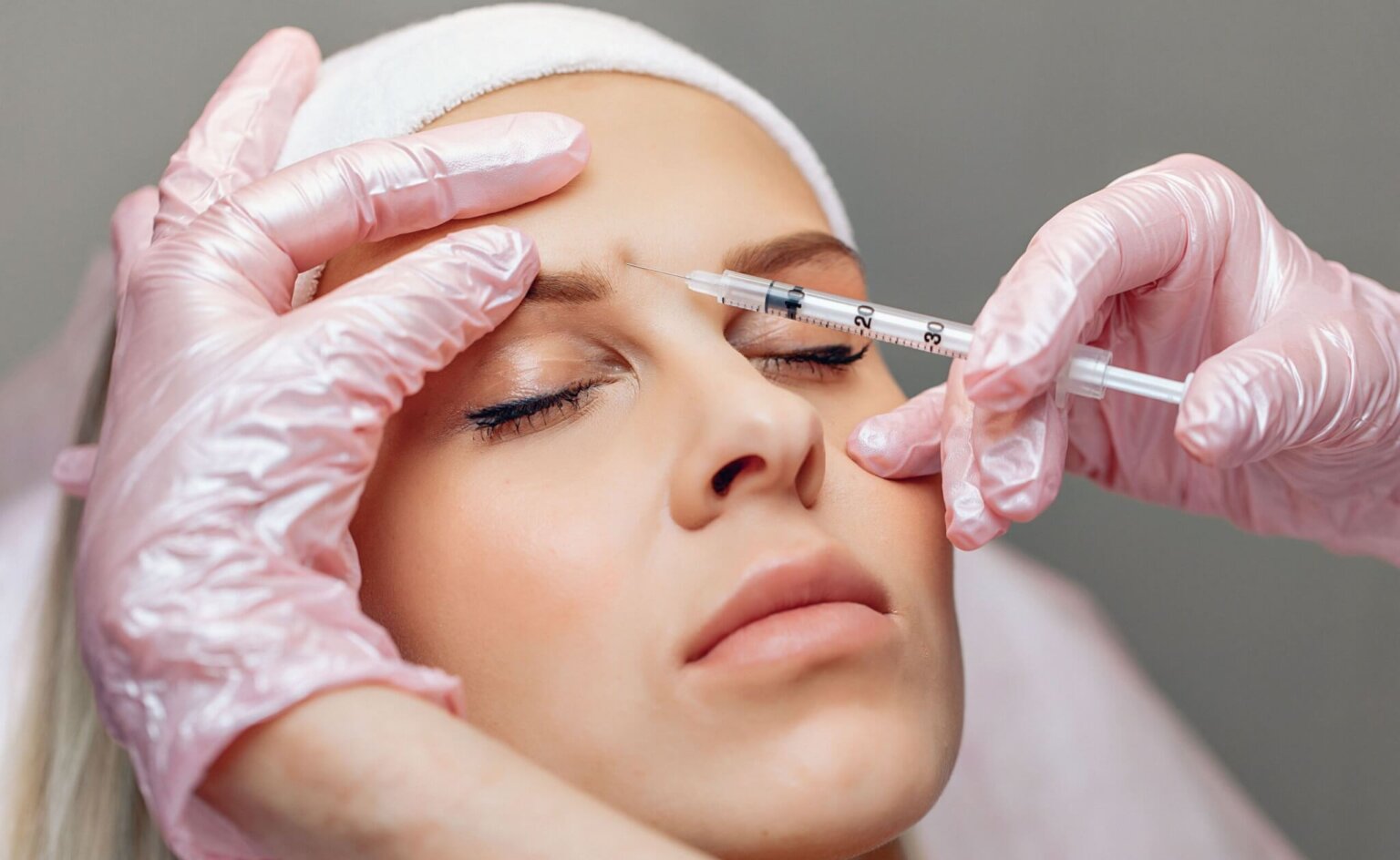 Young woman receiving Botox injection