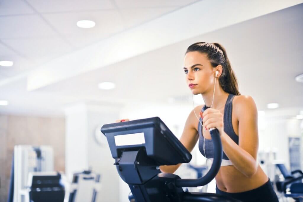 How does exercise impact your skin quality? Woman on exercise machine