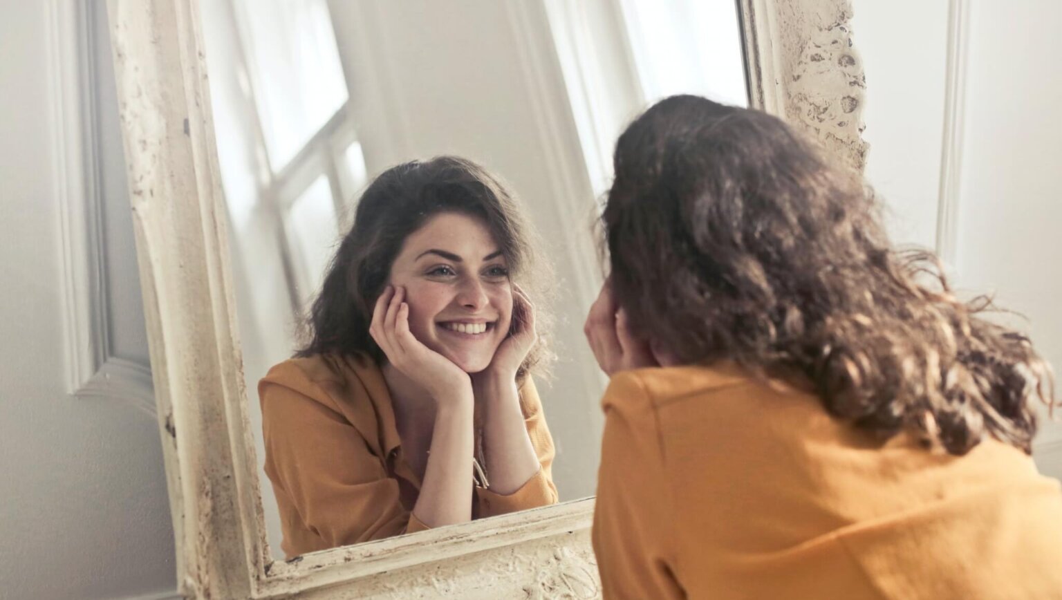 Women showing off clear skin after using derma roller