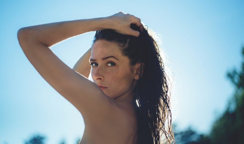 Woman showing & younger skin in the sun